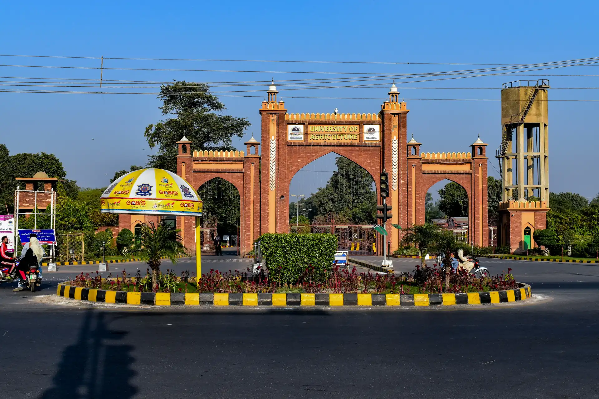 The red-brick gateway of the University of Agriculture on a roundabout in Faisalabad.